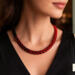 Crimson Noir Kumihimo necklace worn on model, handmade red and black beaded necklace by Bead & Braid Collective